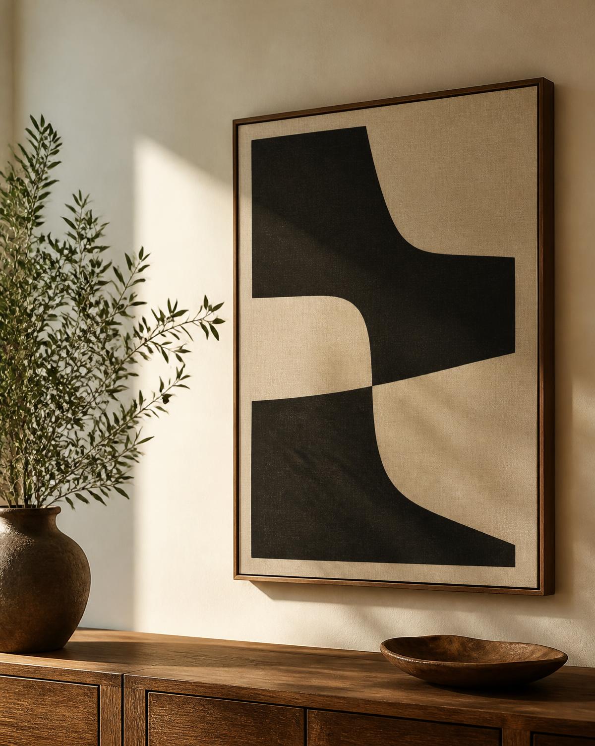 Custom mounted artwork styled on a cream plaster wall beside a warm oak console