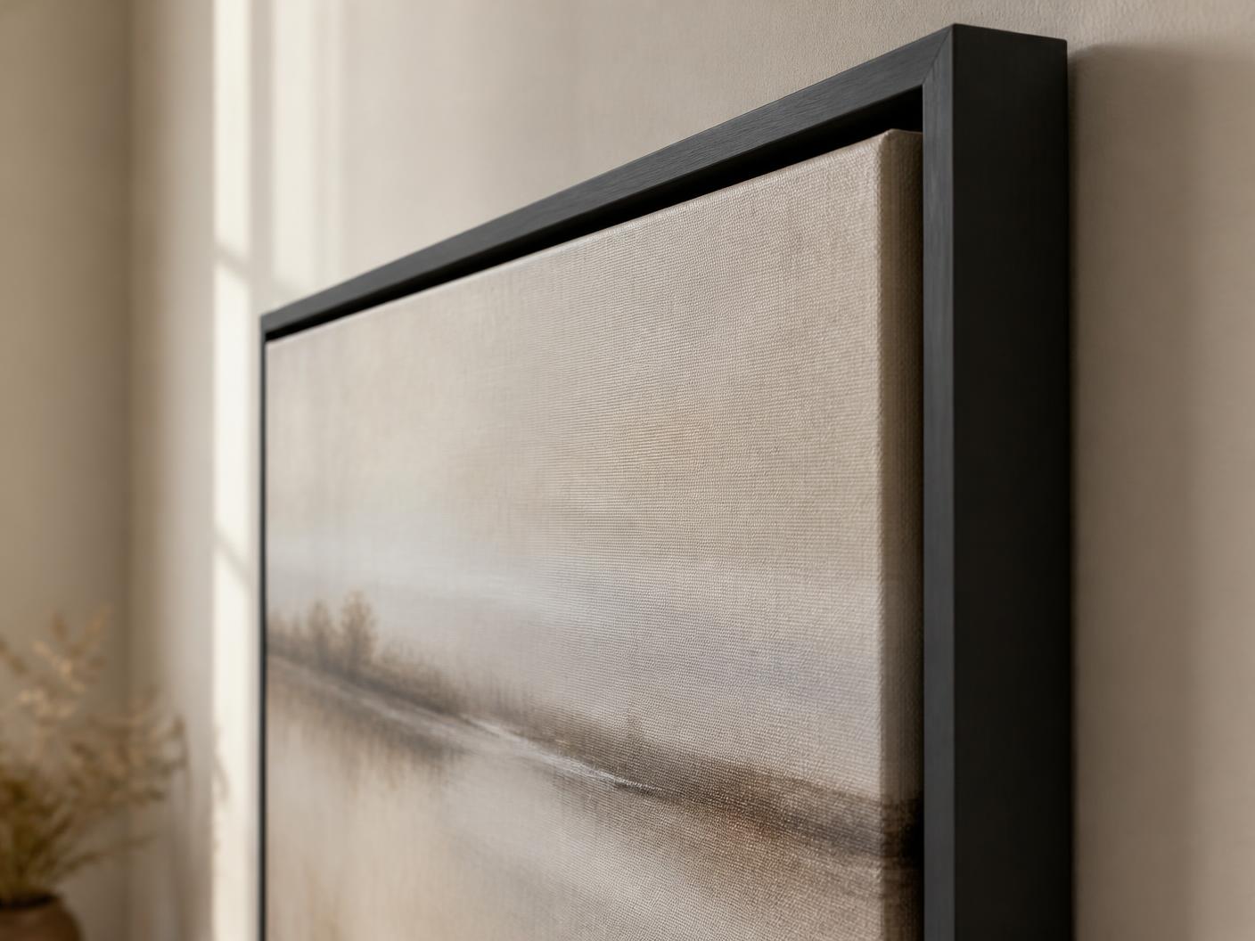 Close-up of a canvas artwork in a black floating frame, showing the gap between canvas and frame