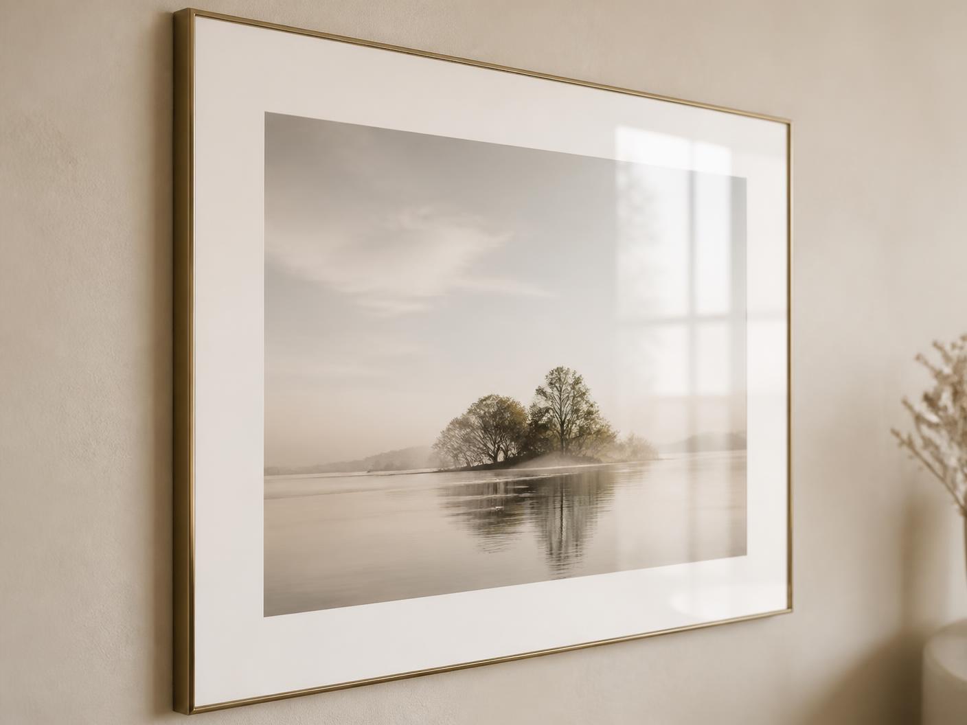 Framed artwork behind glass with a wide white border and a slim elegant frame